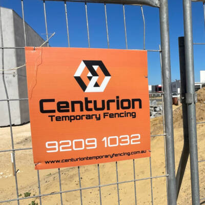 Centurion Temporary Fencing sign on a construction site.